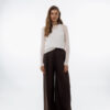 Palazzo pants with pleats at the waist are white